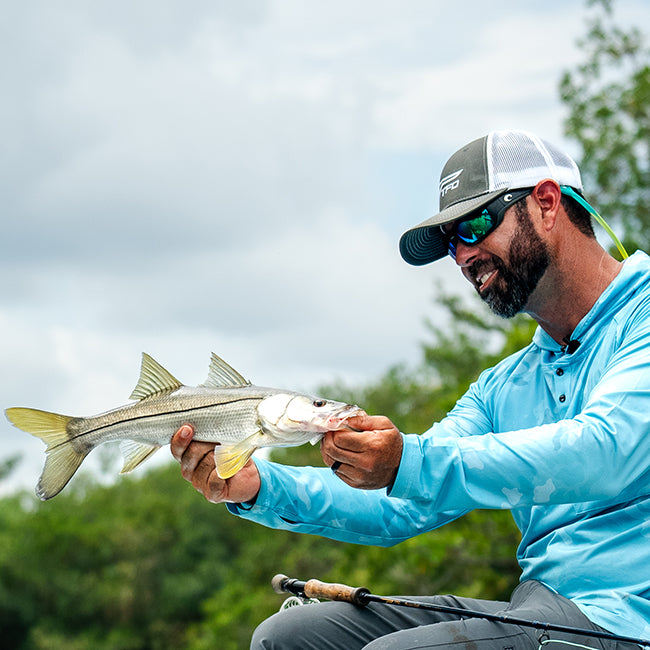 Jonathon Moss holding a fish