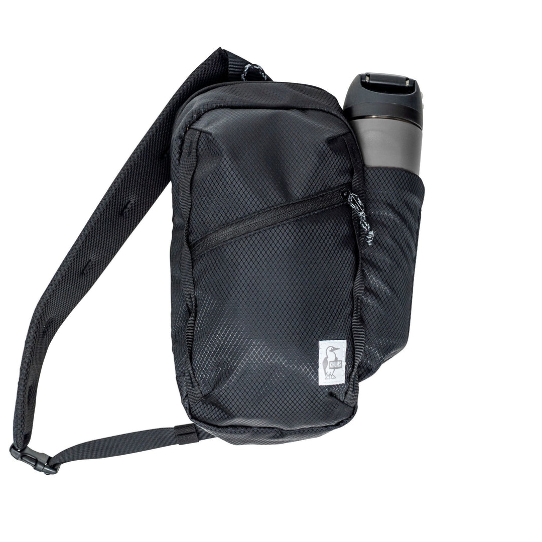 sku:54431100 Daytripper Sling Black Front #color_black